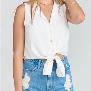 White top, ties at the waist